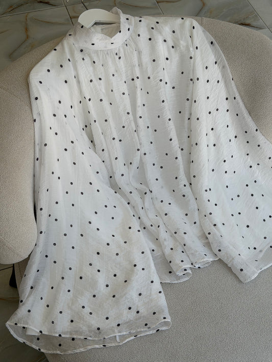 Trending polka dot blouse .