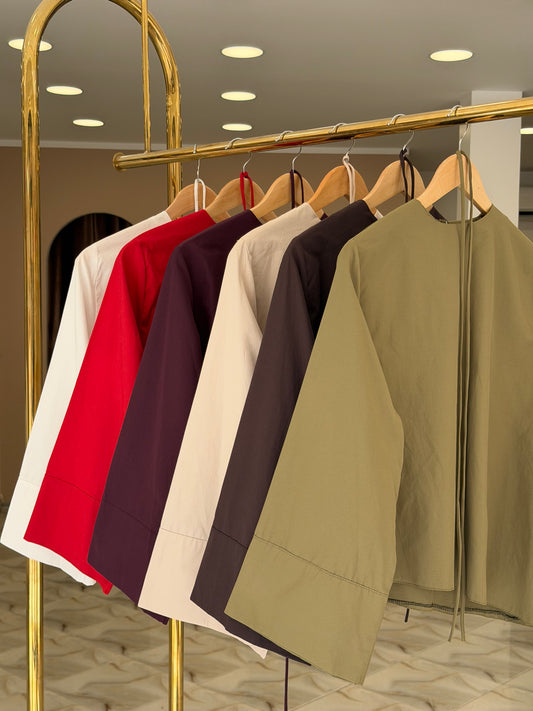 Oversized asymmetric blouse .