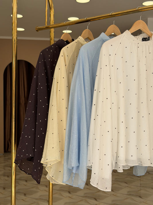 Trending polka dot blouse .